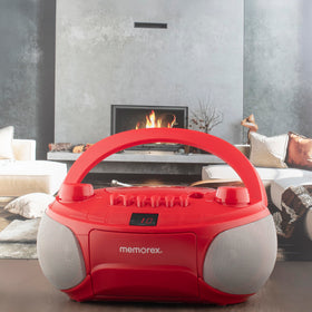 Memorex next to C batteries showing power options for on-the-go use