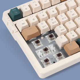 Merdia keyboard in use on desk with laptop for seamless multi-device workflow