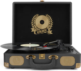 Mersoco turntable beside a stack of LPs demonstrating compact scale and storage