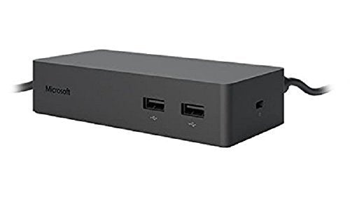 Microsoft Surface Dock ethernet port ready for wired networking in a desk setup.