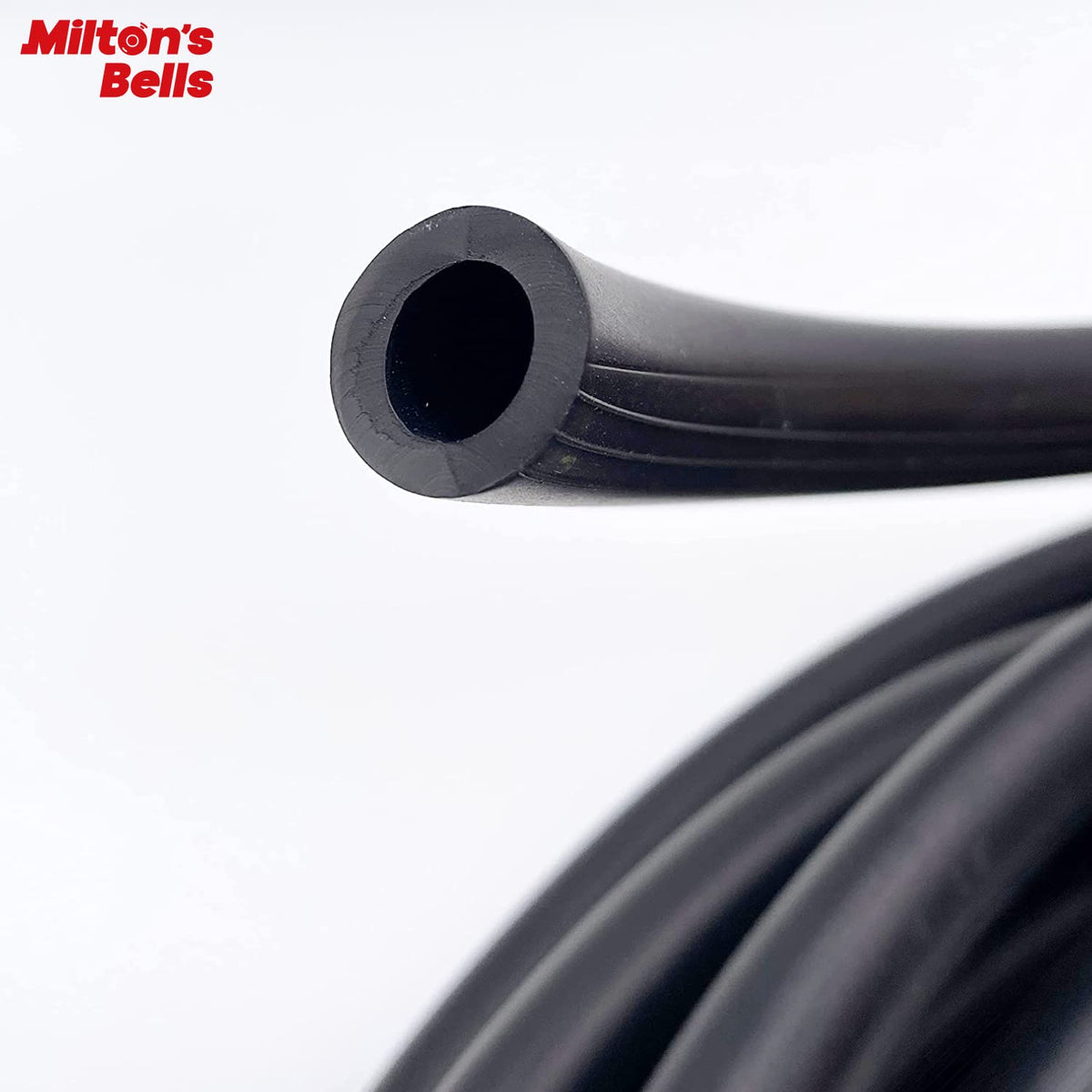 MILTON'S BELLS hose laid across a driveway with car wheel, visible scale for coverage