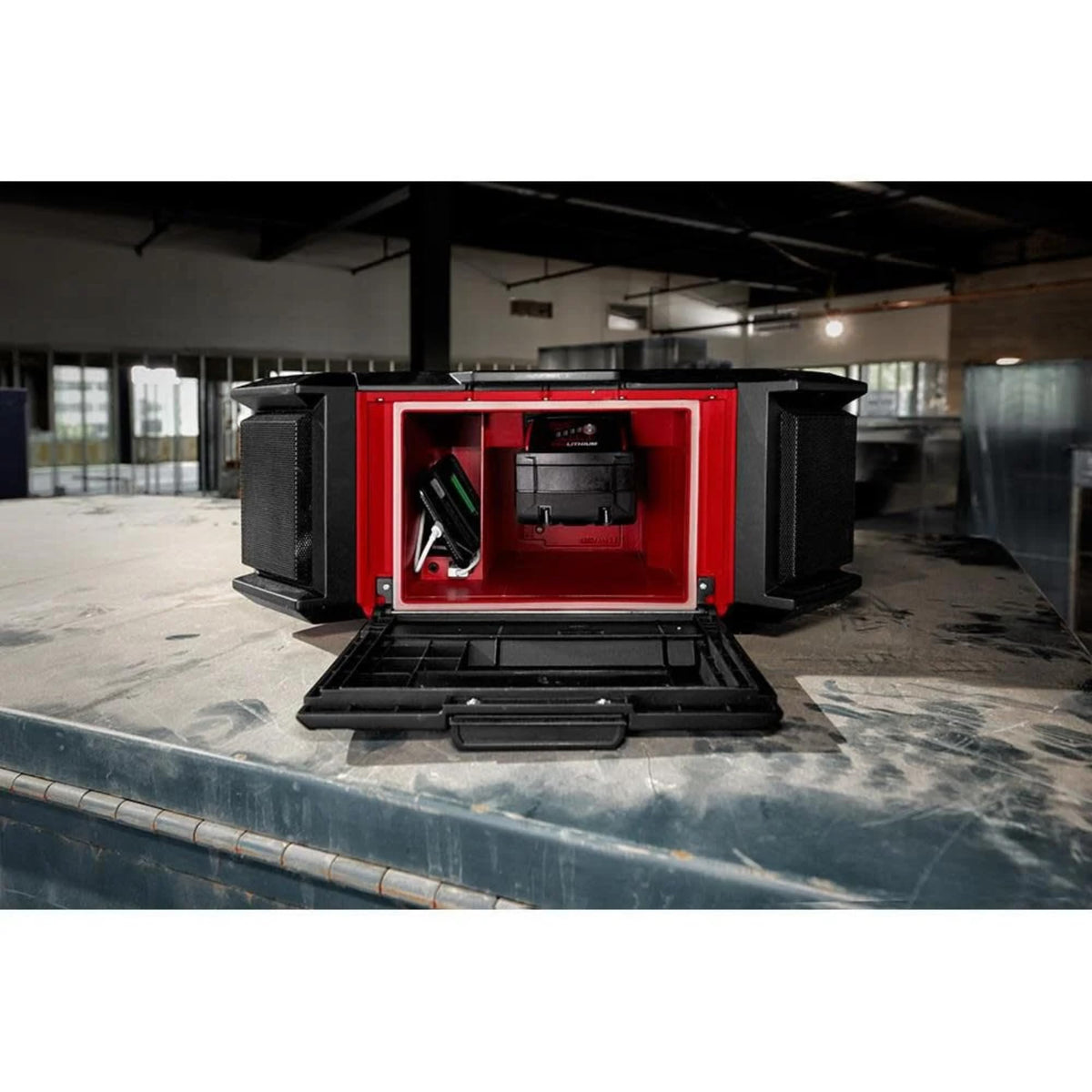 Milwaukee M18 Packout Radio Charger in workshop setup for portable power on the go.