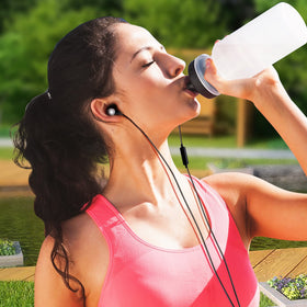 MINDBEAST earbuds used while running showing stable fit and active-use benefit