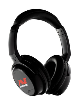 MINELAB ML85 wireless headphones in black on table for immersive music and learning.