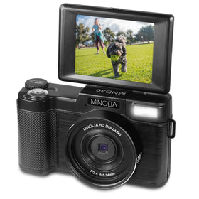 Minolta rotated 180° LCD screen framing a selfie for easy vlogging