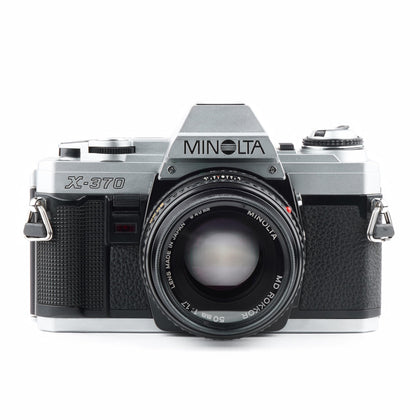 Minolta X-370 front view shows a compact body ideal for street photography.