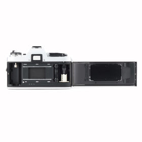 Minolta X-370 MD zoom lens detail highlights versatile focal range.
