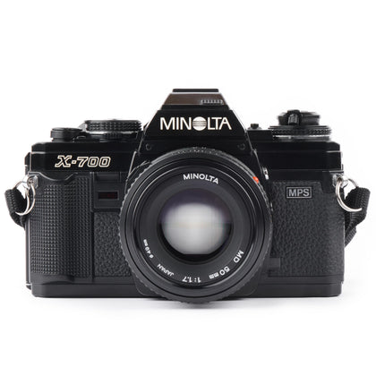 Minolta X-700 camera body viewed front, highlighting ergonomic controls for quick shooting.