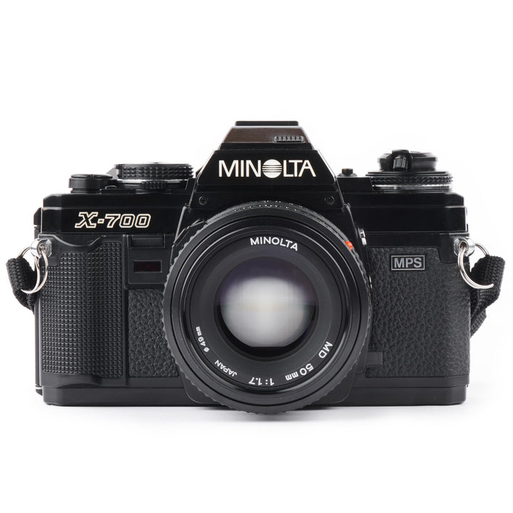 Minolta X-700 camera body viewed front, highlighting ergonomic controls for quick shooting.
