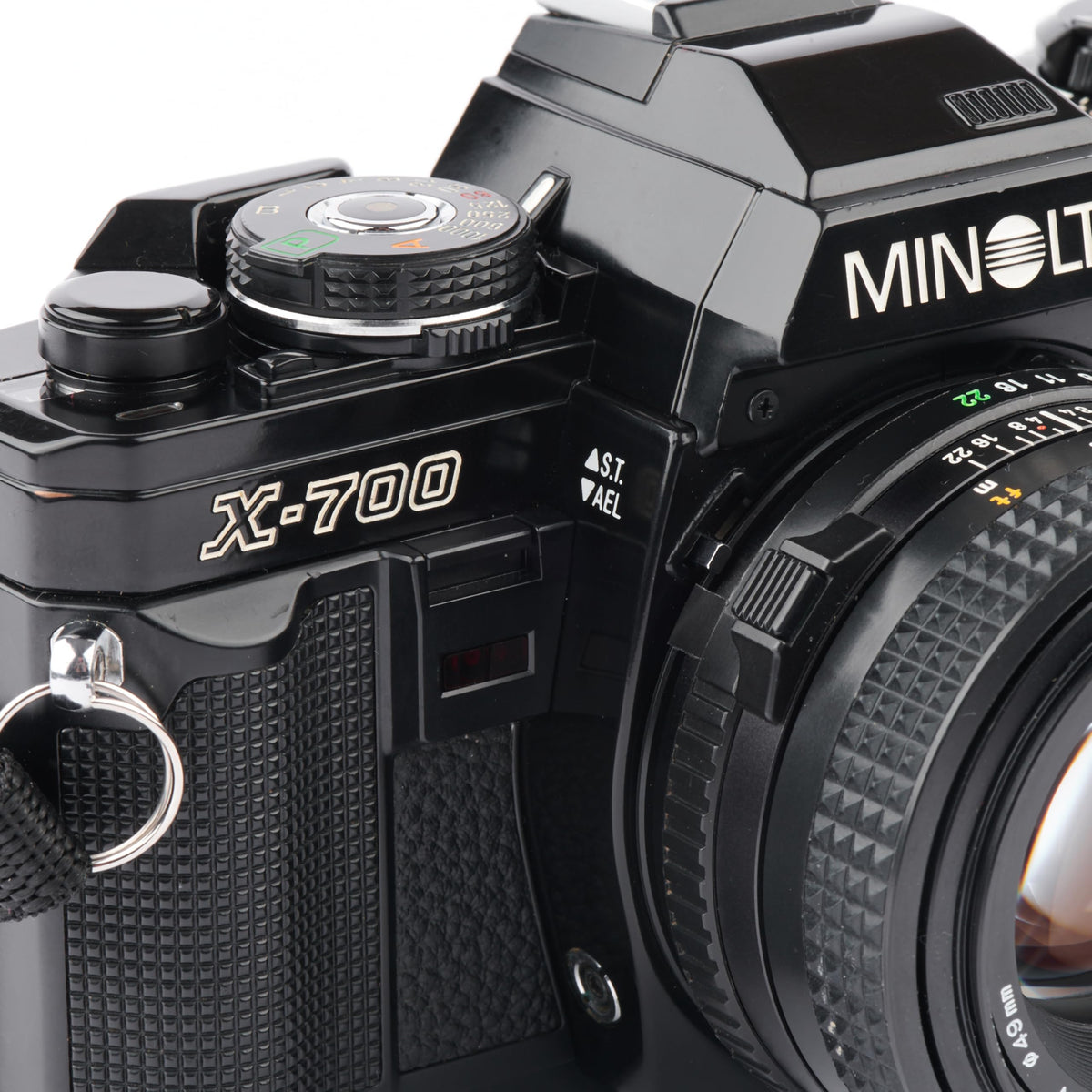 Minolta X-700 TTL metering supports reliable exposure with on-camera lighting.
