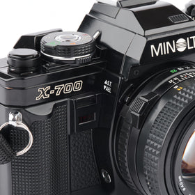 Minolta X-700 TTL metering supports reliable exposure with on-camera lighting.