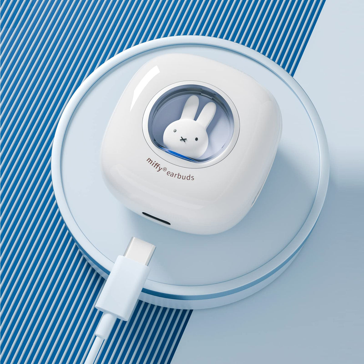 MIPOW Miffy earbuds in hand for scale showing ultra-lightweight design and portability