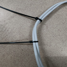 Miwutz garden organization with zip ties tidies hoses and plant supports.