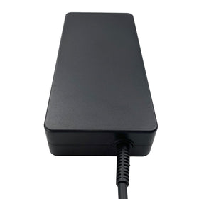 MKVZPV 330W AC adapter in use on a gaming desk for steady power delivery.