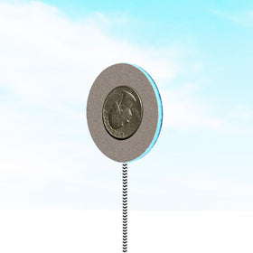 MMUSS padded speaker placed inside a pillow illustrating discreet in-pillow use