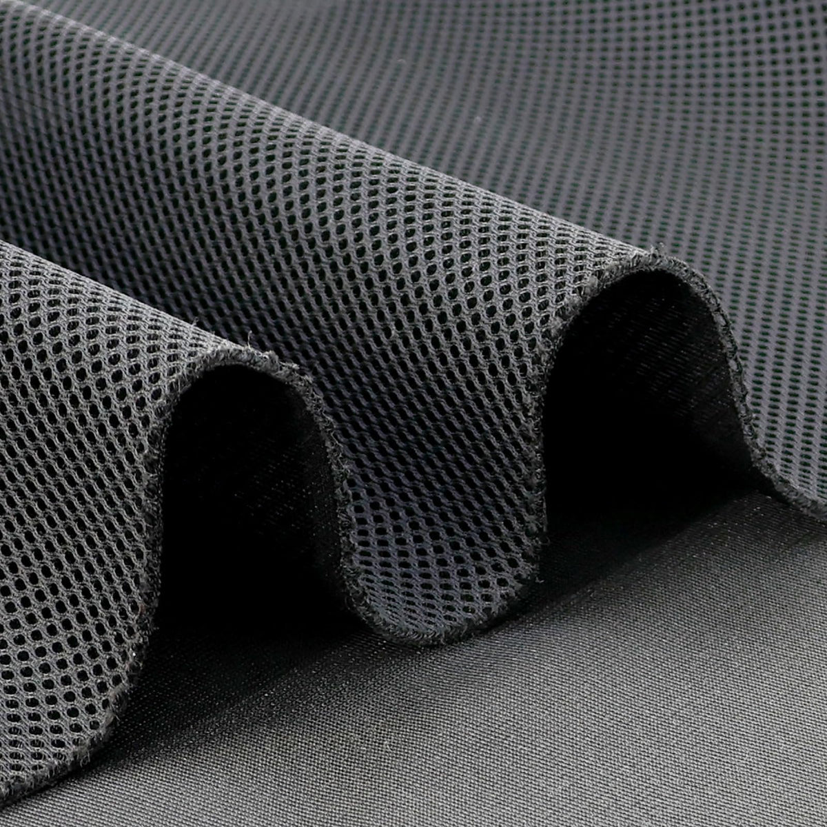 MMute Touch durable mesh closeup highlighting wear-resistant protection for speakers.