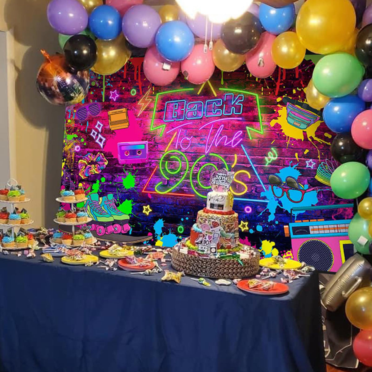 Mocsicka backdrop behind cake table showing how retro design enhances dessert display and theme cohesion
