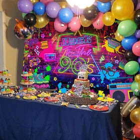 Mocsicka backdrop behind cake table showing how retro design enhances dessert display and theme cohesion