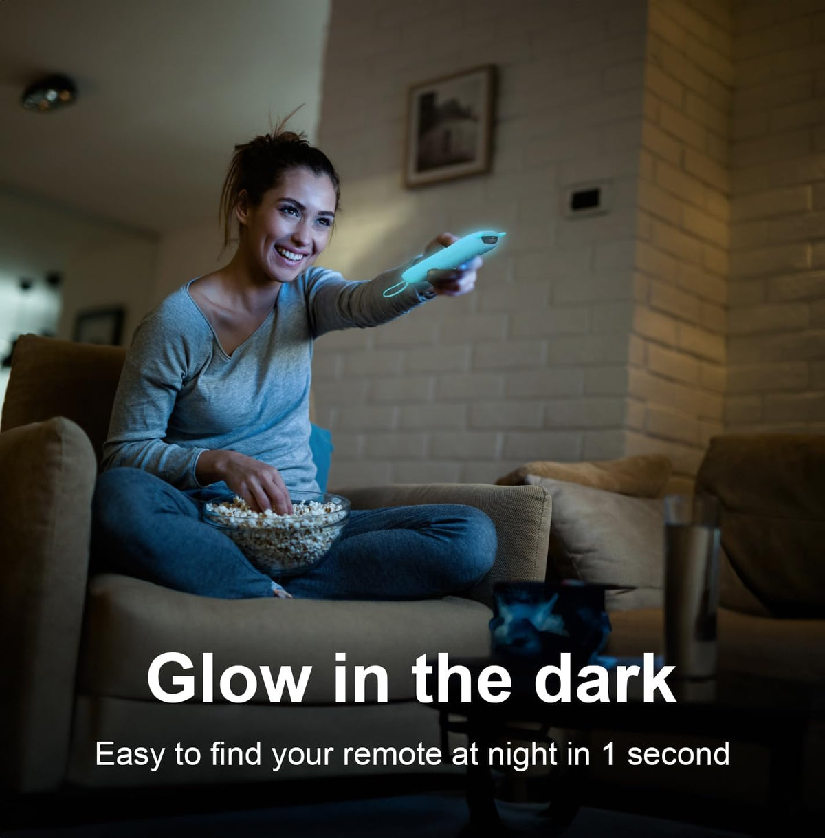 Lifestyle shot of the blue MOKEMAKE remote in a couch corner at night.