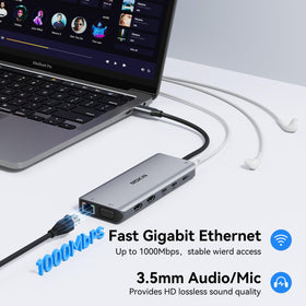 MOKiN docking station beside laptop to show compact scale and portability