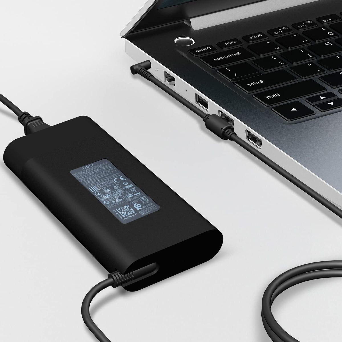 MOLIDZ adapter in use on a ZBook laptop for continuous charging