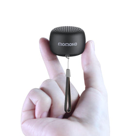 MOMOHO small black mini Bluetooth speaker showing pocket-ready design for travel.