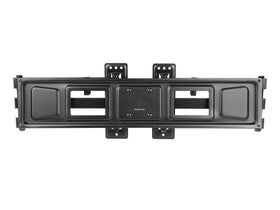 Monoprice mounted curved TV in a corner, illustrating centered placement and improved sightlines