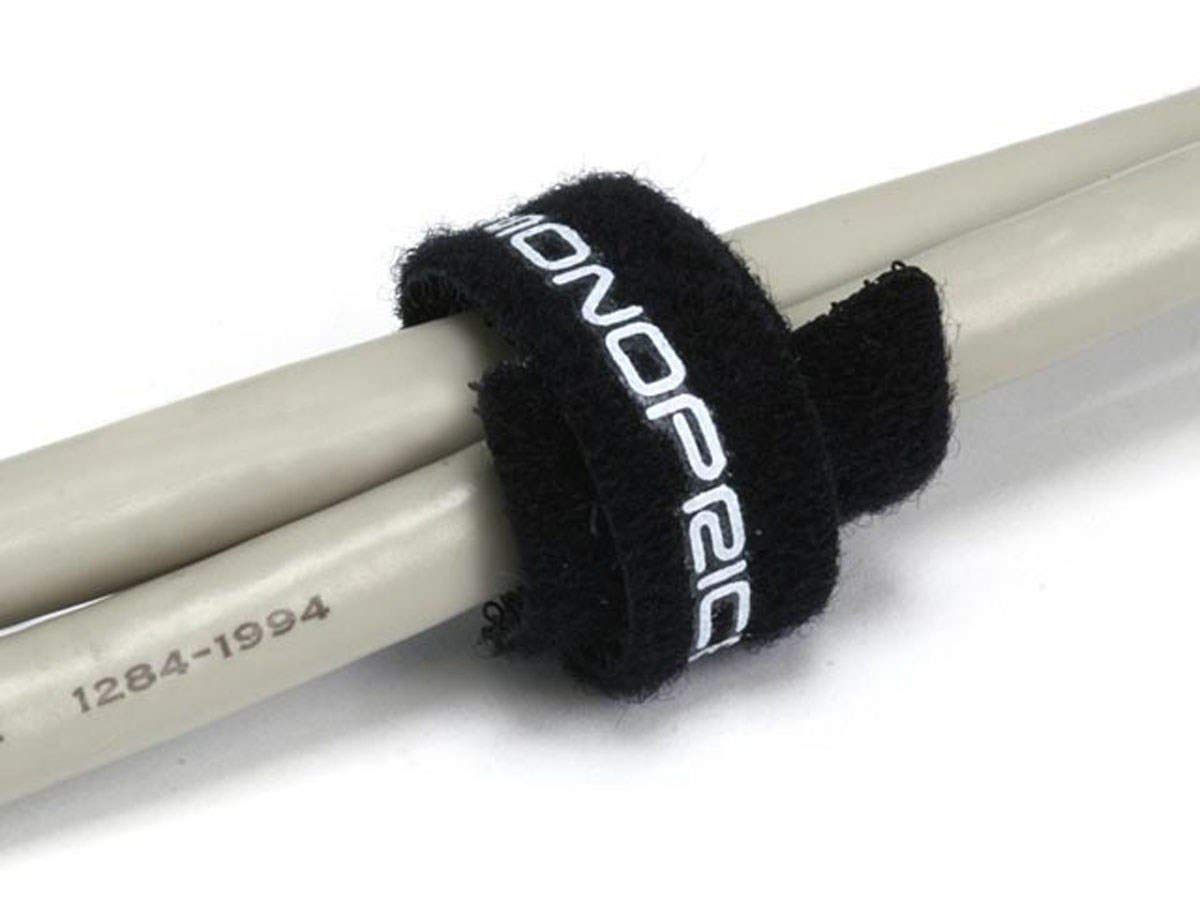 Monoprice tie next to ruler and hand demonstrating 6-inch length and practical scale