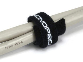Monoprice tie next to ruler and hand demonstrating 6-inch length and practical scale