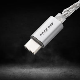 Moondrop FreeDSP connected to IEMs showing balanced output driving headphones