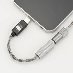 Moondrop FreeDSP Mini USB-C plug detail highlighting sturdy connection and universal compatibility