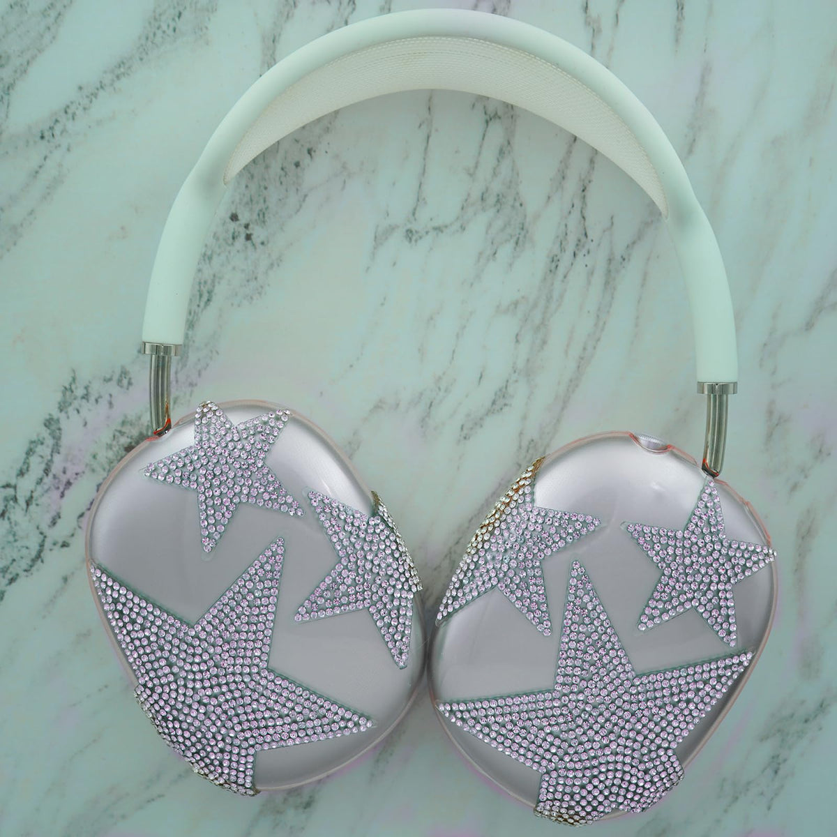 MORWLAT purple star design complements AirPods Max for a cohesive look.