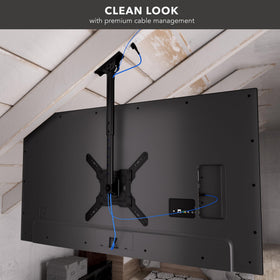 Mount-It! MI-511 mounted TV in living room showing unobstructed wall space benefit