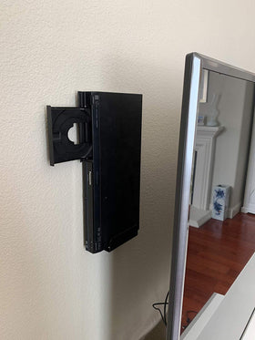 Mount Plus lifestyle shot in living room showing discreet player placement and neater space