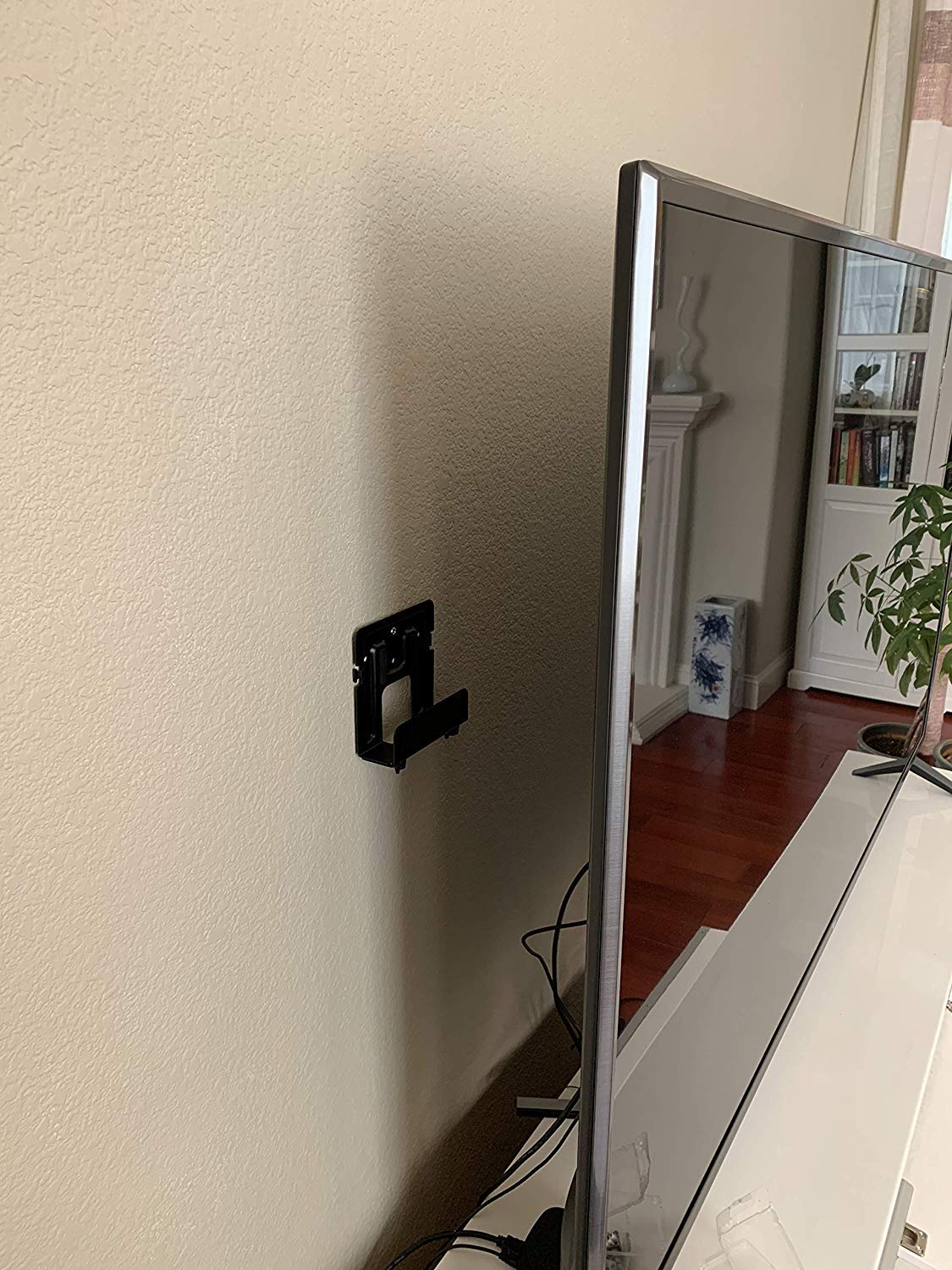 Mount Plus side profile highlighting slim design that preserves TV clearance and airflow