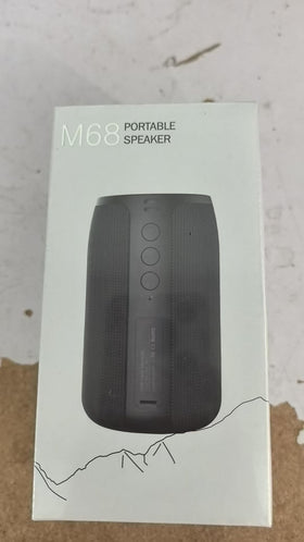 Musibaby on outdoor table powering a garden party with strong wireless audio