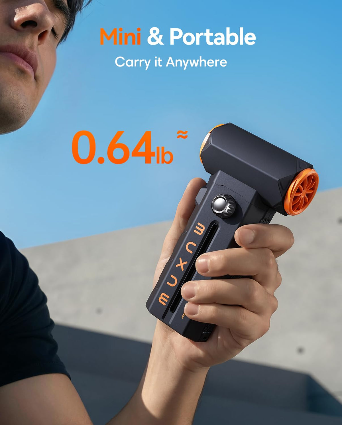 MUXNW held in hand for scale showing portable power and ergonomic grip