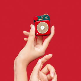 Muzen Button rotary knob for effortless one-handed volume and track control.