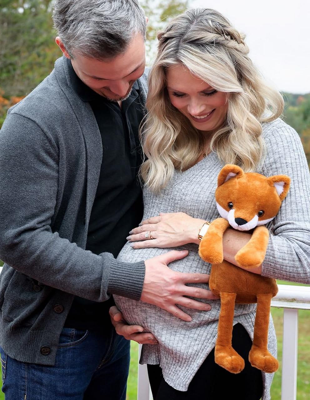 My Baby's Heartbeat Bear fox held by family hands capturing sentimental sharing