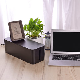 Naeety desk lifestyle showing boxes hiding cords for a clean workspace