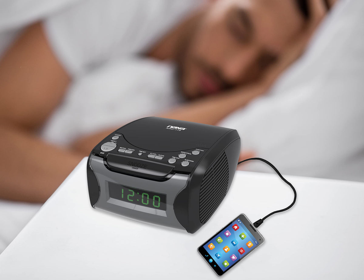 Naxa on bedside table with lamp and book showing practical bedroom use