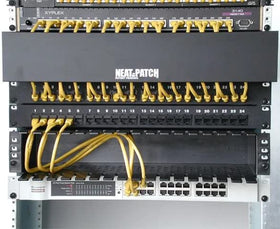 NEAT-PATCH open-compartment closeup demonstrates easy storage of excess cables