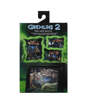 NECA Brain Gremlin accessories laid out including pipe syringe and serum for storytelling