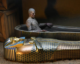 NECA diorama scene with sarcophagus and chest enhancing horror display impact