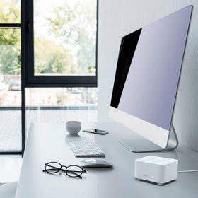 NETGEAR Orbi RBK13 installed in living room showing improved whole‑home Wi‑Fi connectivity