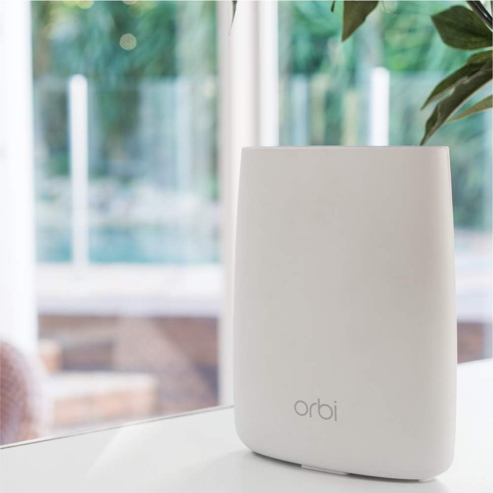 NETGEAR Orbi RBS50 in living room demonstrating extended coverage