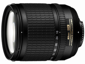 Nikon 18-135mm zoom lens close-up, ED glass hinting at crispness and color.