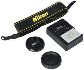 Nikon D3400 in hand on a travel-ready setup.