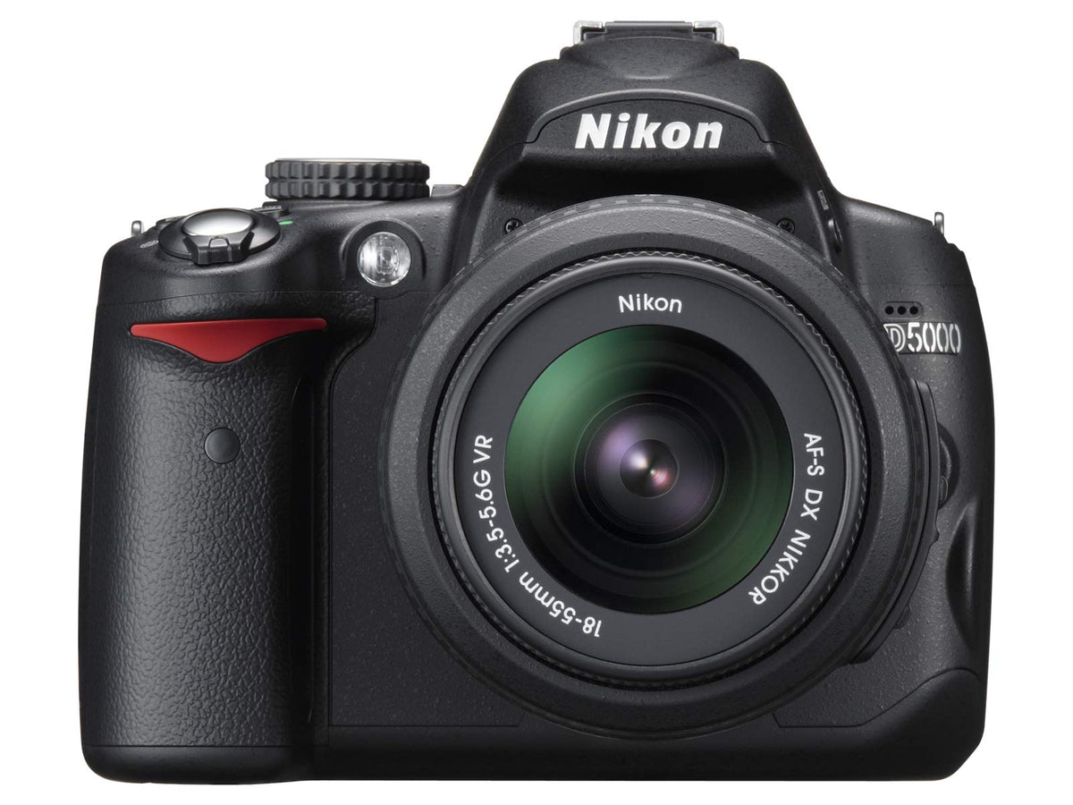 Nikon D5000 front view with body and lens, ready for travel photography.