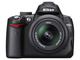 Nikon D5000 front view with body and lens, ready for travel photography.